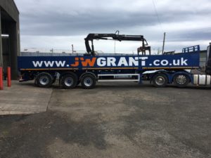 Builders merchant trailer fully repainted and lettered to customer livery